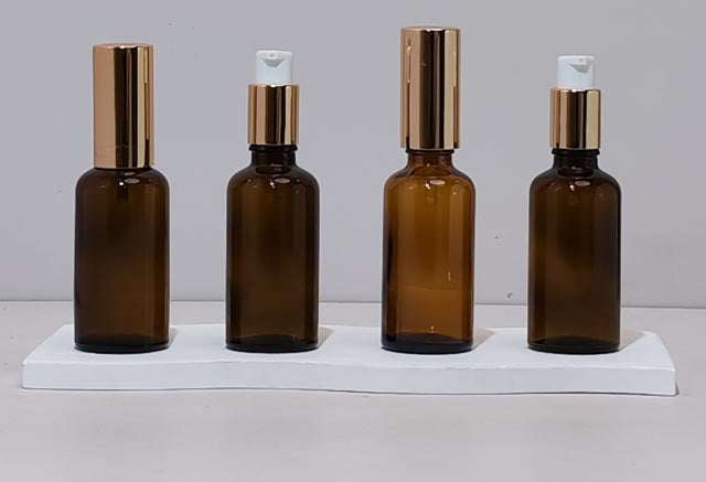 50Ml Glass Bottle With Gold Treatment Pump (Round)