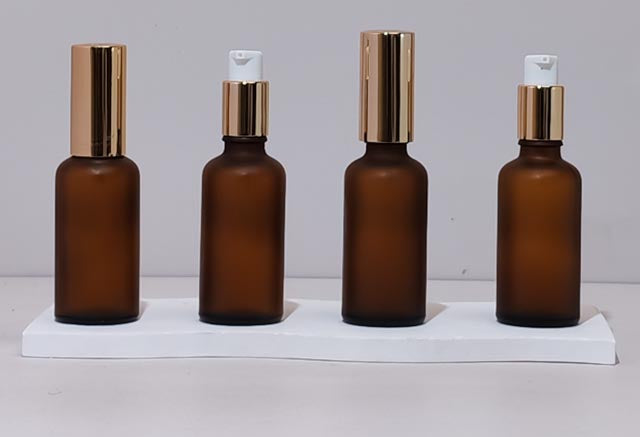 50Ml Glass Bottle With Gold Treatment Pump (Round)