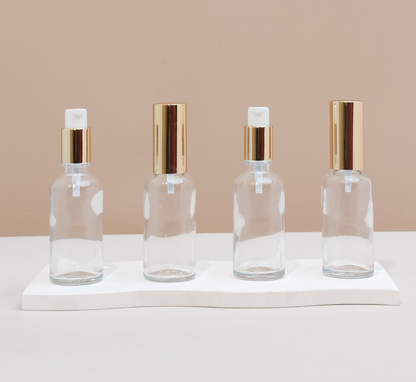 50Ml Glass Bottle With Gold Treatment Pump (Round)
