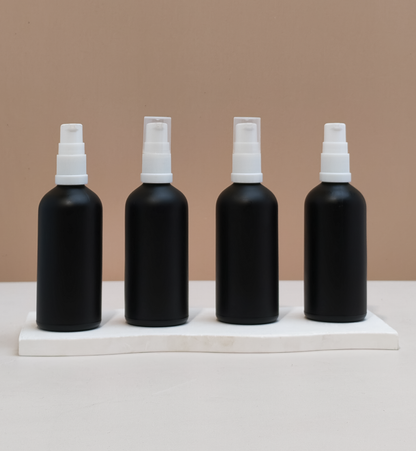 100Ml Glass Bottle With White Treatment Pump (Round)