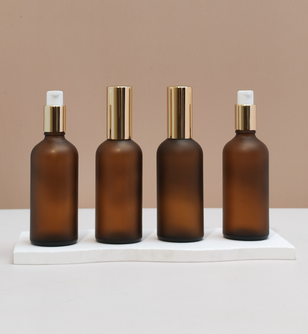 100ml Glass Bottles with Gold Treatment Pump