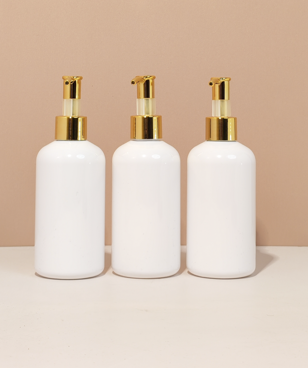 250Ml Short Pet Bottle With All Gold Lotion Pump