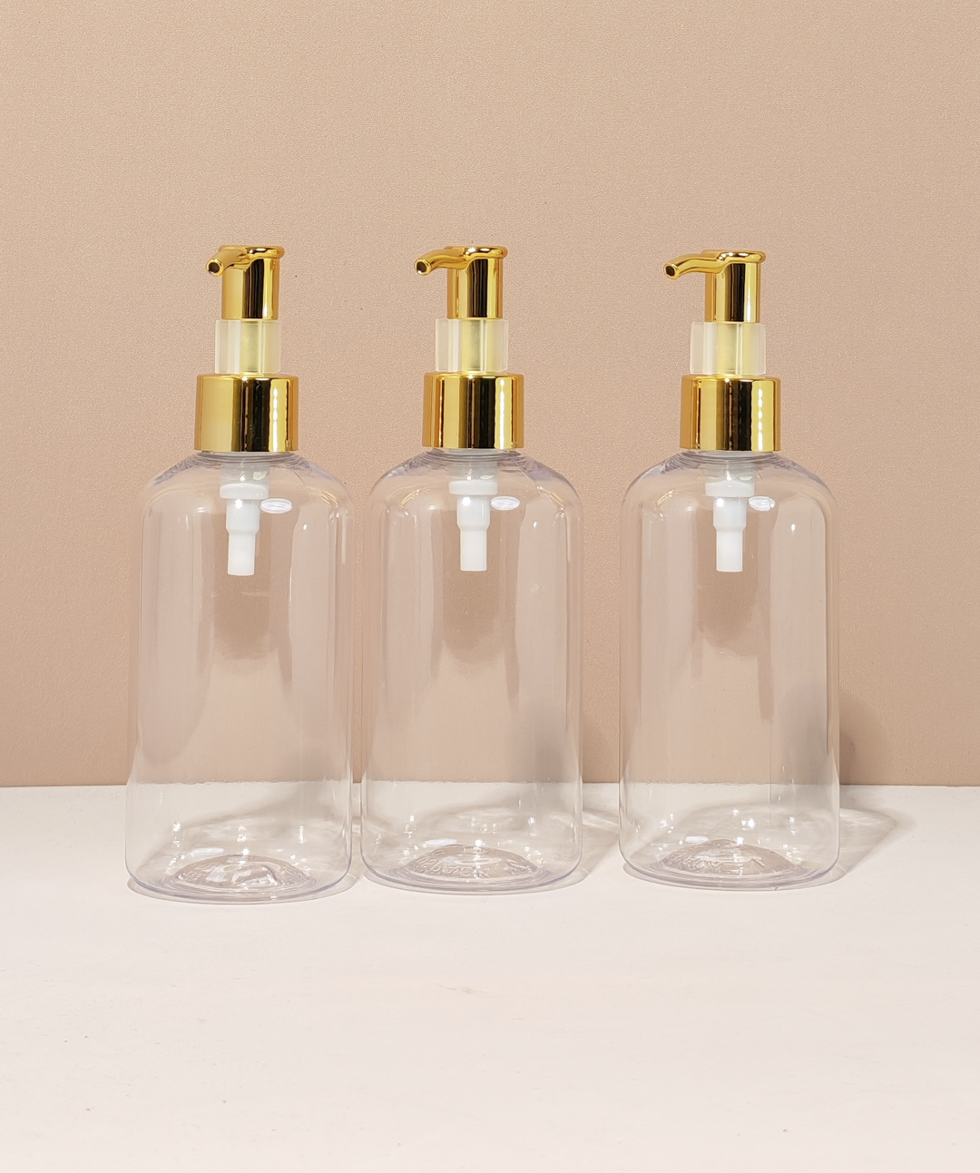 250Ml Short Pet Bottle With All Gold Lotion Pump