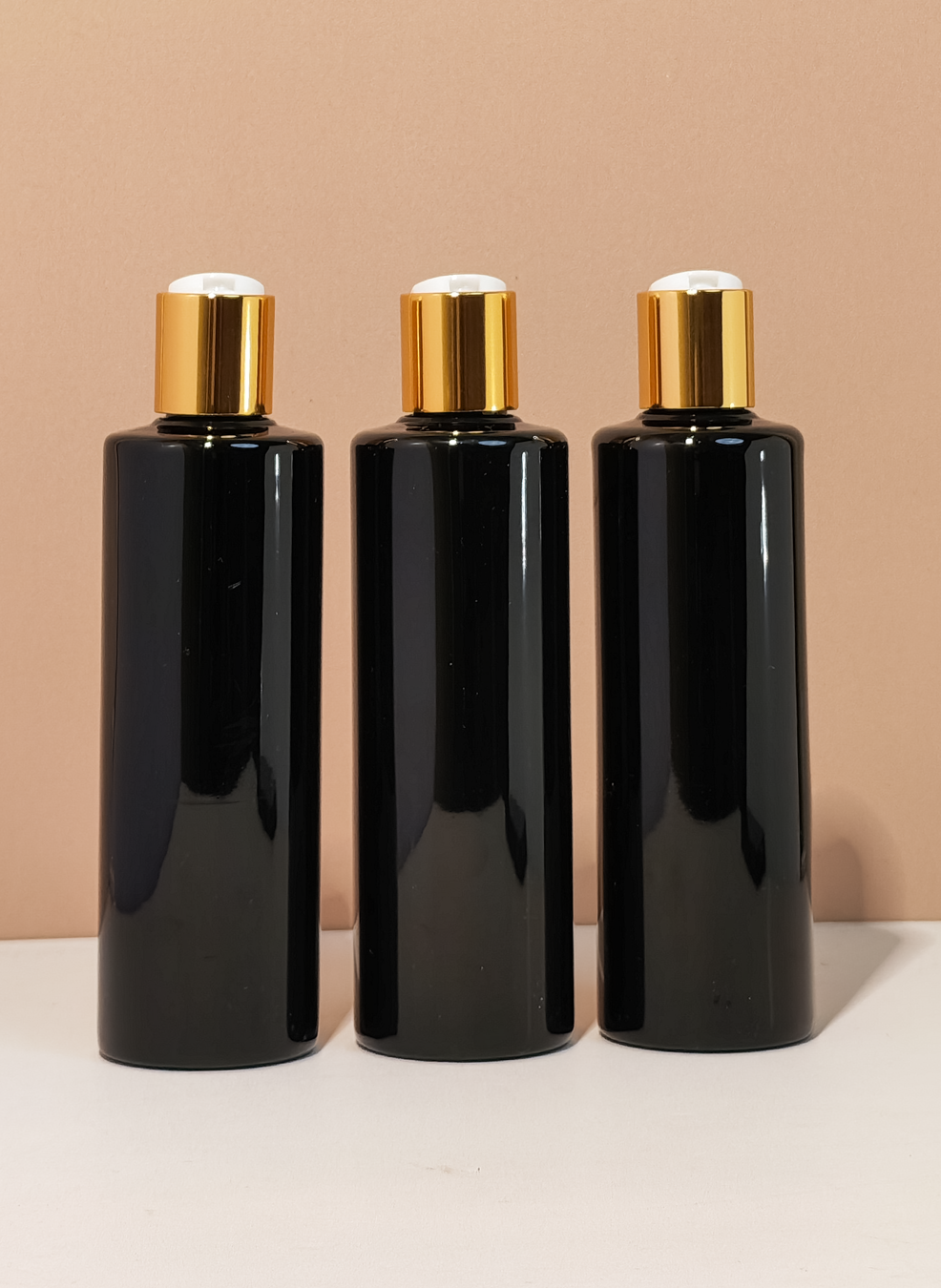 250Ml Tall Pet Bottle With Gold Press Cap