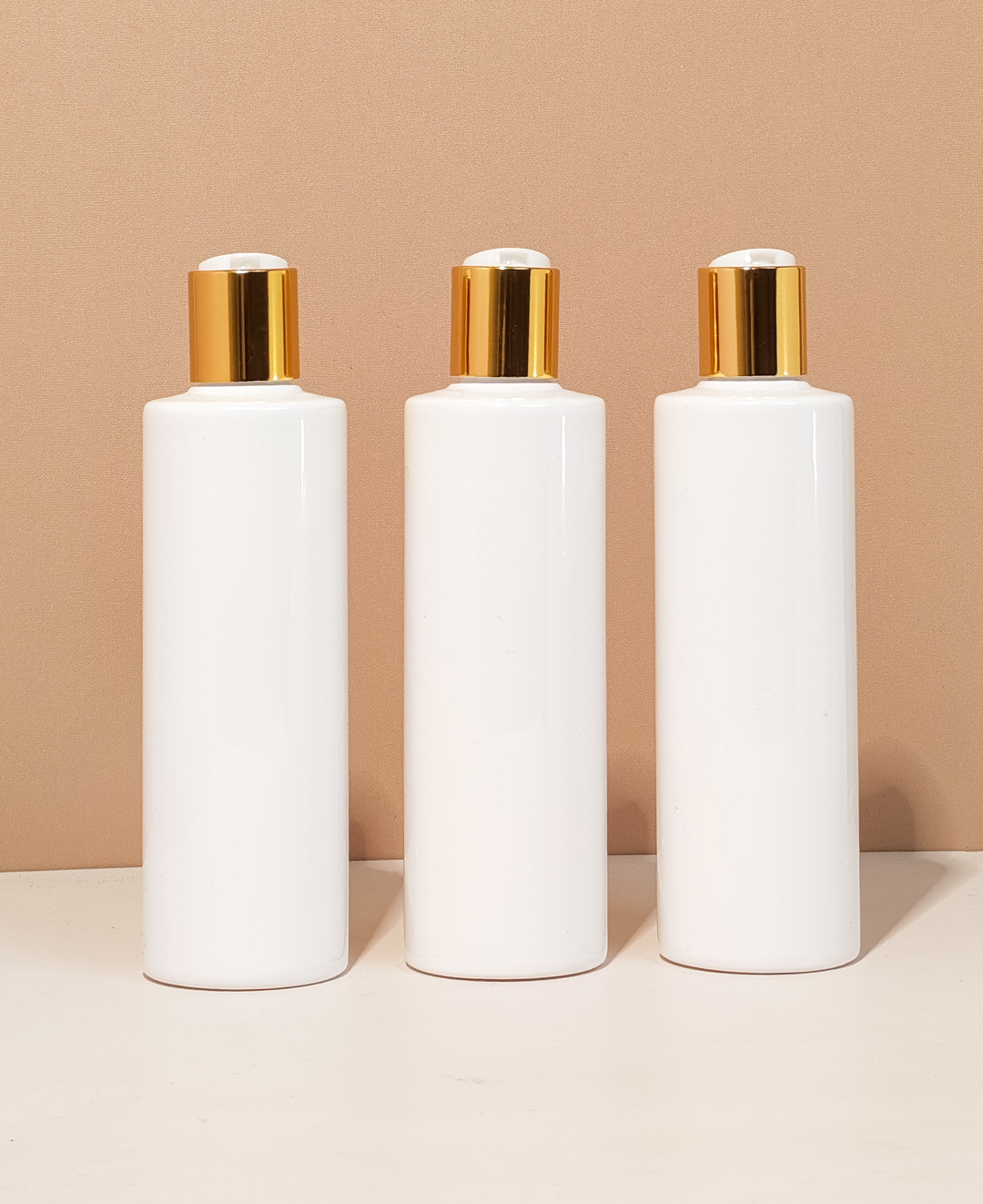 250Ml Tall Pet Bottle With Gold Press Cap