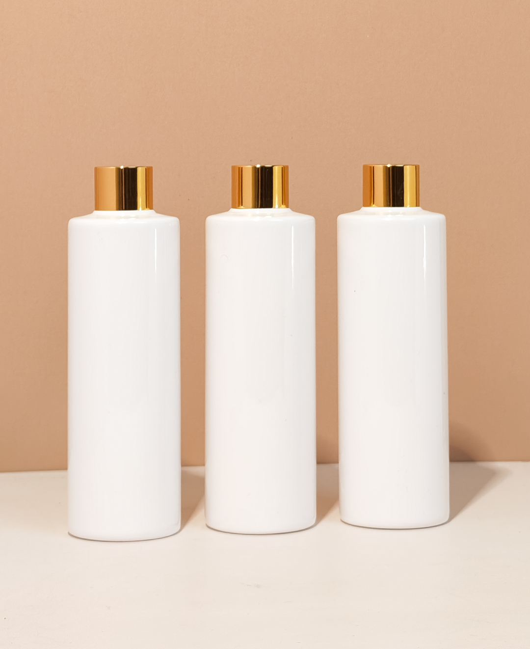 250Ml Tall Pet Bottle With Gold Shinny Screw Caps