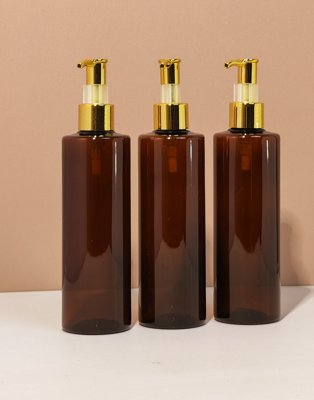 250Ml Tall Pet Bottle With All Gold Lotion Pump