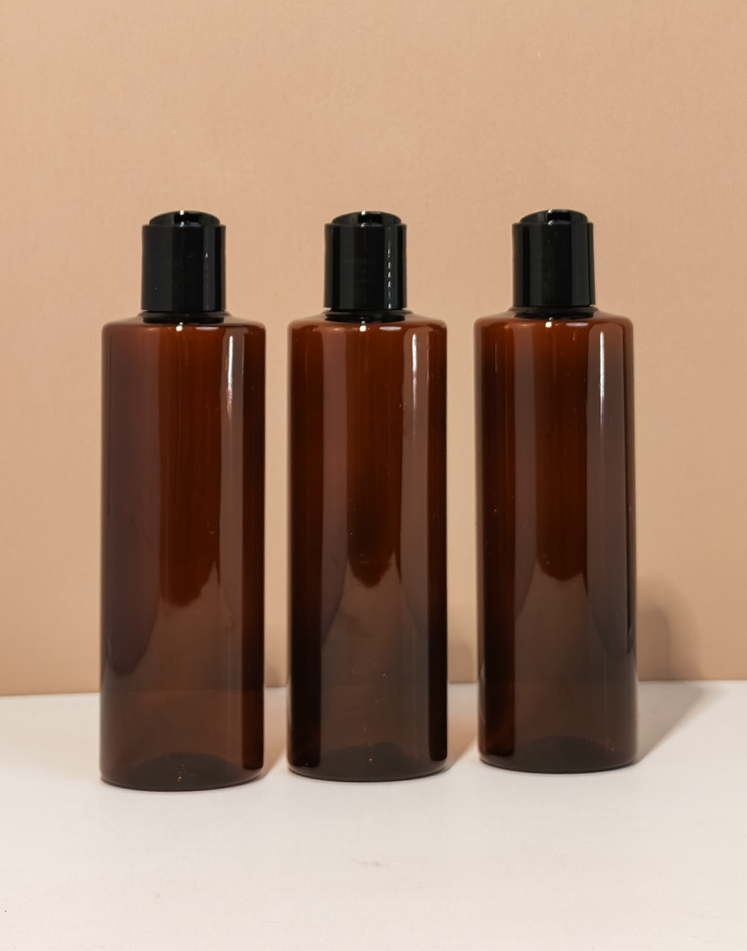 250Ml Tall Pet Bottle With Black Press Cap