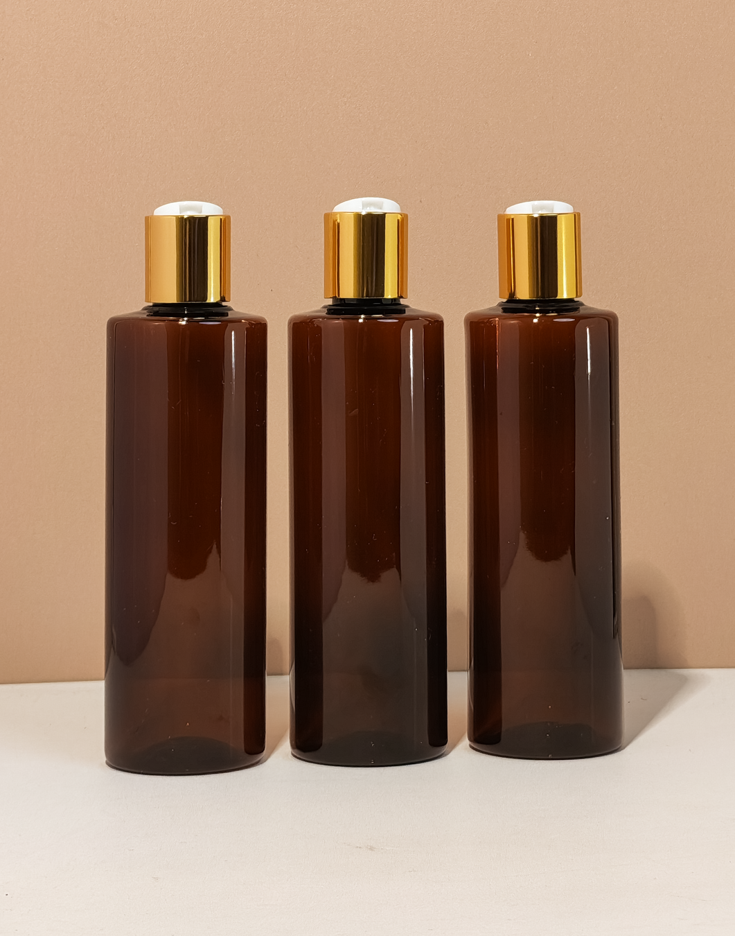 250Ml Tall Pet Bottle With Gold Press Cap
